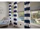 Bright windows overlooking the pool and garden complemented by stylish blue and white curtains at 7520 Paradiso Dr, Apollo Beach, FL 33572