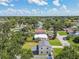 Expansive aerial view of a home showcasing its well-maintained yard, and surrounding neighborhood at 7806 N Matanzas Ave, Tampa, FL 33614