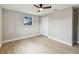 Bedroom featuring a ceiling fan, a window, neutral paint, and a closet with paneled doors at 7806 N Matanzas Ave, Tampa, FL 33614