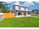 Inviting two-story home featuring a well-manicured lawn and stylish exterior at 7806 N Matanzas Ave, Tampa, FL 33614