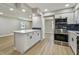 Spacious kitchen featuring a large island, stainless steel appliances, and plenty of cabinet space at 7806 N Matanzas Ave, Tampa, FL 33614