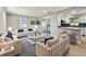 Bright, open-concept living room featuring a kitchen and stylish modern furnishings at 7806 N Matanzas Ave, Tampa, FL 33614