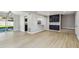 Spacious living room leading to the backyard, seamlessly connecting indoor and outdoor living at 7806 N Matanzas Ave, Tampa, FL 33614