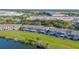Aerial view of homes backing onto a scenic lake, showcasing the community's serene location at 8251 118Th Ave # 8251, Largo, FL 33773
