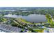 Beautiful aerial view of homes surrounding a serene lake, nestled in a lush, green landscape at 8251 118Th Ave # 8251, Largo, FL 33773