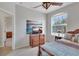 Bedroom featuring comfortable bed, TV, and natural light at 8251 118Th Ave # 8251, Largo, FL 33773