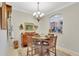 A quaint dining room with an archway into the kitchen at 8251 118Th Ave # 8251, Largo, FL 33773