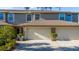 The townhome has an attached two-car garage and a well maintained yard at 8251 118Th Ave # 8251, Largo, FL 33773