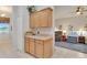 A hallway features extra cabinets for storage and an open view of the living area at 8251 118Th Ave # 8251, Largo, FL 33773