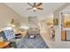 Spacious living room offering views of the staircase, dining area, and kitchen at 8251 118Th Ave # 8251, Largo, FL 33773