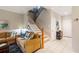 Cozy living room with a staircase and an open view of the upstairs at 8251 118Th Ave # 8251, Largo, FL 33773