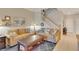 Inviting living room with a staircase and a view of the dining area at 8251 118Th Ave # 8251, Largo, FL 33773
