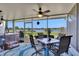 Enclosed patio offers lake views, comfortable seating, and a hot tub at 8251 118Th Ave # 8251, Largo, FL 33773