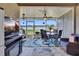 Screened-in patio with comfortable seating and stunning lake views at 8251 118Th Ave # 8251, Largo, FL 33773