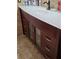 This vanity has a white countertop, updated cabinet, and modern hardware, offering style and functionality at 8718 Lindenhurst Pl, Tampa, FL 33634