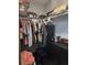 This walk-in closet offers ample hanging space and storage, keeping clothes organized at 8718 Lindenhurst Pl, Tampa, FL 33634