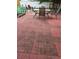 Cozy outdoor patio with brick flooring and ample seating at 8718 Lindenhurst Pl, Tampa, FL 33634