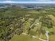 Aerial view of land showcasing a property with mature trees and ample green space surrounded by natural beauty at 8843 Kenton Rd, Wesley Chapel, FL 33545