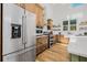 Updated kitchen with stainless steel appliances, custom cabinets, and hardwood floors at 8843 Kenton Rd, Wesley Chapel, FL 33545