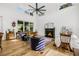 Bright and airy living room features high ceilings, a fireplace, and hardwood floors at 8843 Kenton Rd, Wesley Chapel, FL 33545