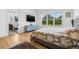 Spacious main bedroom featuring large windows with peaceful views at 8843 Kenton Rd, Wesley Chapel, FL 33545