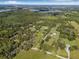 An aerial view outlining the expansive property lines of a home featuring verdant landscapes and mature trees at 8843 Kenton Rd, Wesley Chapel, FL 33545