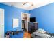 Bedroom with a ceiling fan, open closet and a black dresser with a TV on top at 915 Windton Oak Dr, Ruskin, FL 33570
