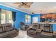 A cozy living room offers multiple seating options with an open view to the kitchen at 915 Windton Oak Dr, Ruskin, FL 33570