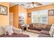 Living room features a comfortable sofa and natural light, creating a relaxing space at 915 Windton Oak Dr, Ruskin, FL 33570