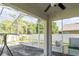 Enclosed screened patio overlooking a backyard and features a ceiling fan at 915 Windton Oak Dr, Ruskin, FL 33570
