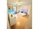 bedroom featuring hardwood floors, window, decor, and natural light at 945 College Hill Dr, Clearwater, FL 33765