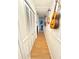 Hallway with guitars hanging on the wall and closets at 945 College Hill Dr, Clearwater, FL 33765