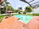 Relaxing pool area with seating and shade, perfect for outdoor enjoyment and entertaining at 945 College Hill Dr, Clearwater, FL 33765