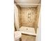 Tiled shower with mosaic accent stripe, niche, shower head and toilet at 945 College Hill Dr, Clearwater, FL 33765