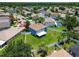 Aerial view of the backyard, with mature trees, a well-maintained lawn, privacy fence and proximity to neighborhood amenities at 1032 Jacob Way, Odessa, FL 33556