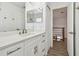Modern bathroom with sleek white cabinets and double mirrors at 1032 Jacob Way, Odessa, FL 33556