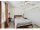 Comfortable bedroom with a bed, lamps, and large closet space at 1032 Jacob Way, Odessa, FL 33556