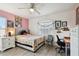 Bedroom featuring a comfy bed, desk, and stylish decor at 1032 Jacob Way, Odessa, FL 33556
