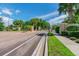 The gated entrance to Ivy Lake Estates features stone pillars, lush foliage and a well manicured median at 1032 Jacob Way, Odessa, FL 33556