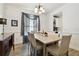 Cozy dining area with wood floors, neutral decor, and natural light, ideal for entertaining at 1032 Jacob Way, Odessa, FL 33556