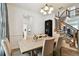 Bright dining room featuring a modern chandelier and a staircase, perfect for Gathering dinners at 1032 Jacob Way, Odessa, FL 33556