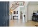 Spacious open-concept foyer with high ceilings, wood staircase and tile flooring, offering a welcoming feel at 1032 Jacob Way, Odessa, FL 33556