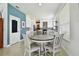 Charming eat-in kitchen with white cabinetry, stone countertops, and modern appliances at 1032 Jacob Way, Odessa, FL 33556