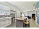 Spacious kitchen featuring white cabinets, butcher block island with bar stools, and an open layout at 1032 Jacob Way, Odessa, FL 33556