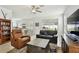 Comfortable living room featuring tile floors, ample natural light, and modern decor at 1032 Jacob Way, Odessa, FL 33556