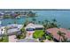 Aerial view of the waterfront home, showcasing the private dock and expansive water views at 11055 7Th E St, Treasure Island, FL 33706