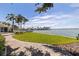 Beautifully landscaped backyard and walkway leading to waterfront and private dock at 11055 7Th E St, Treasure Island, FL 33706