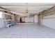 Spacious garage with tile flooring, storage cabinets and workbench, perfect for projects at 11055 7Th E St, Treasure Island, FL 33706