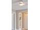 Hallway in a home featuring doors and a clear view of a sunlit window at 11055 7Th E St, Treasure Island, FL 33706