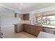 Beautiful kitchen featuring wood cabinets, stainless steel appliances, tile backsplash, and water views at 11055 7Th E St, Treasure Island, FL 33706